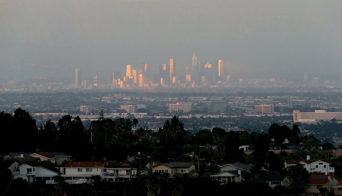 A smoggy haze shrouds downtown Los Angeles on a November afternoon in 2015.
