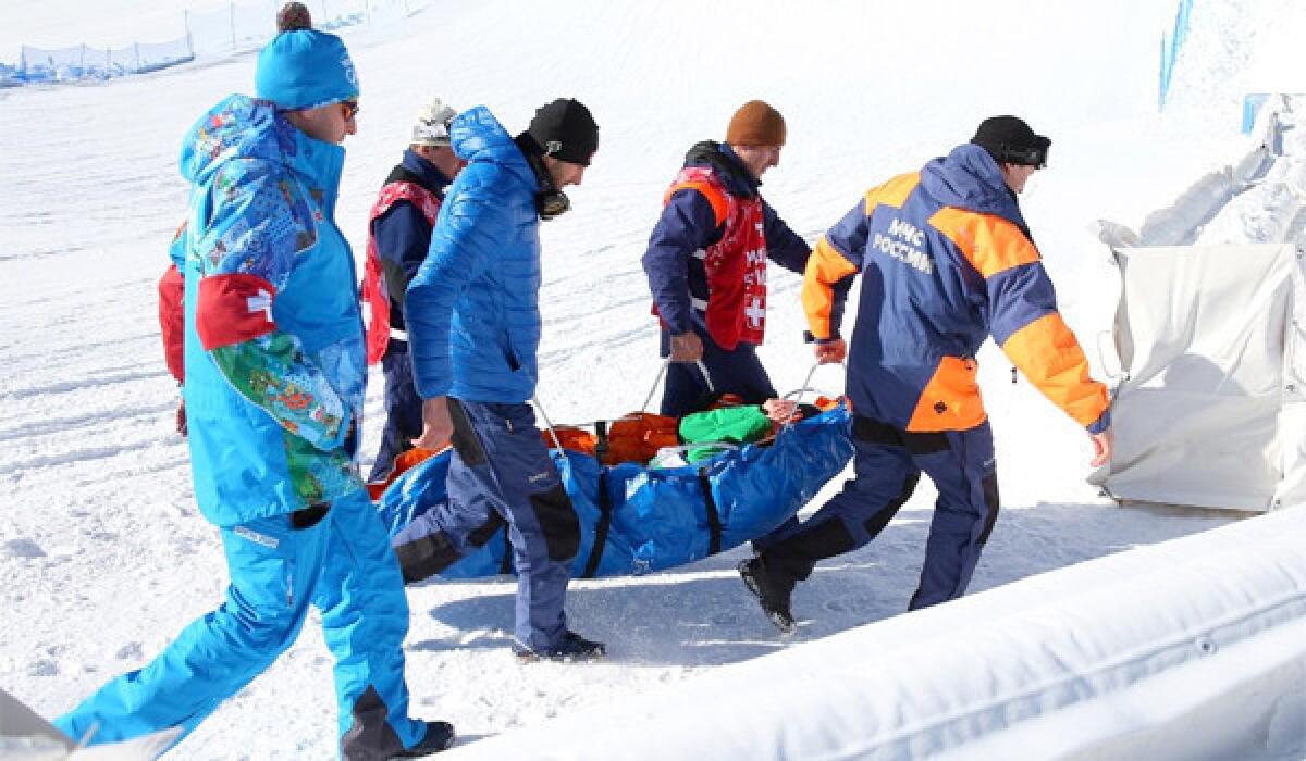 Snowboarder Marika Enne of Finaldn is carried off on a stretcher after a crash landing on the final jump of the slopestyle course at the Rosa Khutor Extreme Park prior to the Sochi 2014 Winter Olympics.