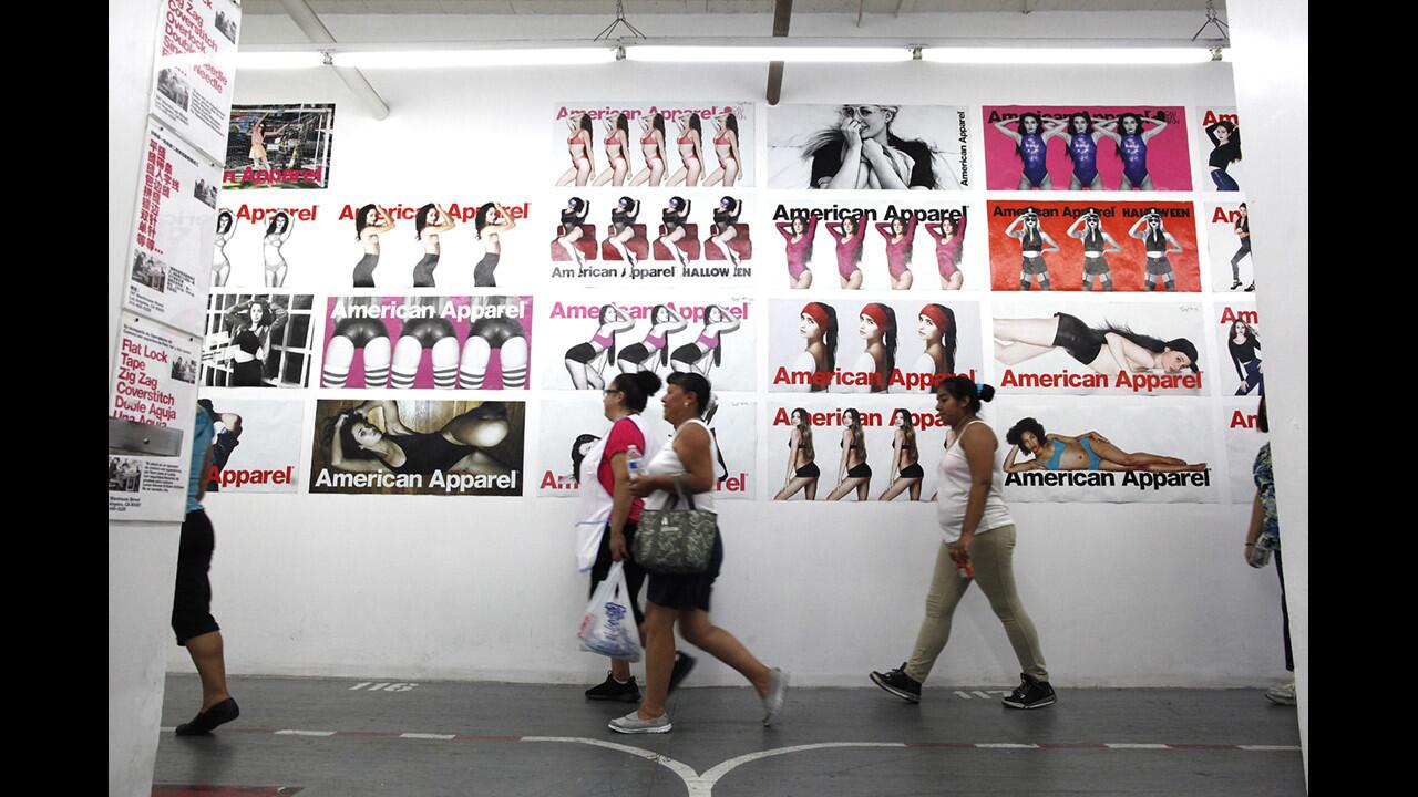 American Apparel garment workers arrive for work at the Los Angeles headquarters in 2014.