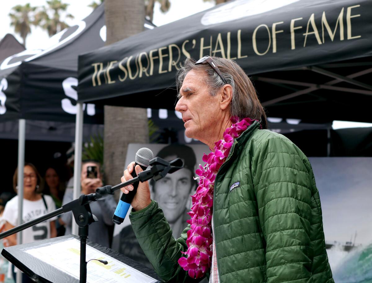 Steve Wheat, father of Surfers' Hall of Fame inductee Casey Wheat, speaks at a ceremony.