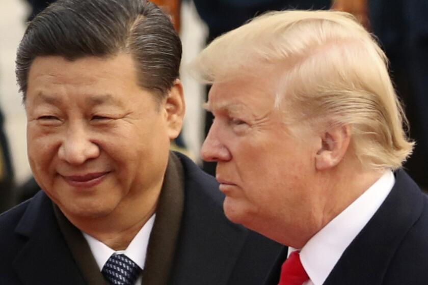 FILE - In this Nov. 9, 2017, file photo, U.S. President Donald Trump and Chinese President Xi Jinping in Beijing, China. 