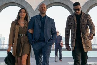 Aubrey Plaza, from left, Jason Statham and Bugzy Malone in the movie "Operation Fortune: Ruse de guerre."