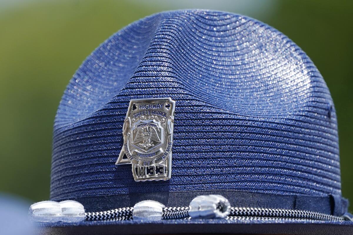FILE - The emblem of a Mississippi Highway Patrol badge on a "cover," the hat worn by uniformed officers, is shown June 30, 2021, taken at a ceremony in Pearl, Miss. The Mississippi Department of Public Safety said on Aug. 12, 2022, that its investigation into an incident involving a white Mississippi Highway Patrol officer and three Black men showed no evidence of criminal conduct by the state trooper. The investigation was launched after a viral video showed the officer putting a handcuffed man into a chokehold and wrestling him into a ditch, Friday, Aug. 12, 2022, in McComb, Miss. (AP Photo/Rogelio V. Solis, File)