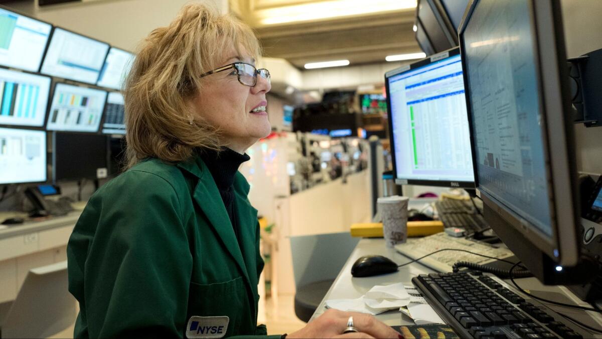 Maria Averna, a lead supervisor for New York Stock Exchange Operations, monitors trading at the exchange.
