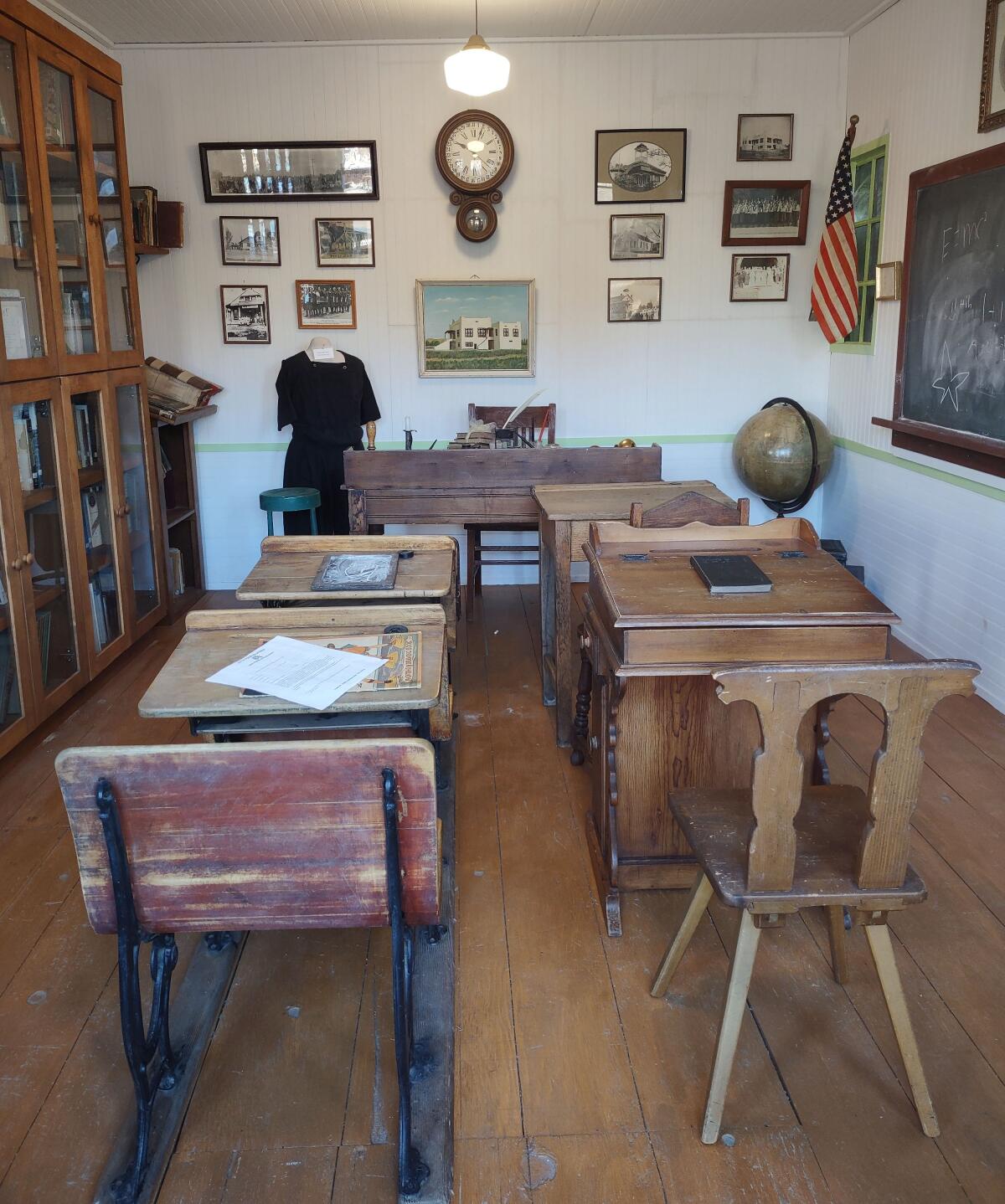 Museum visitors get to see inside a replica of an 1800s one-room schoolhouse.