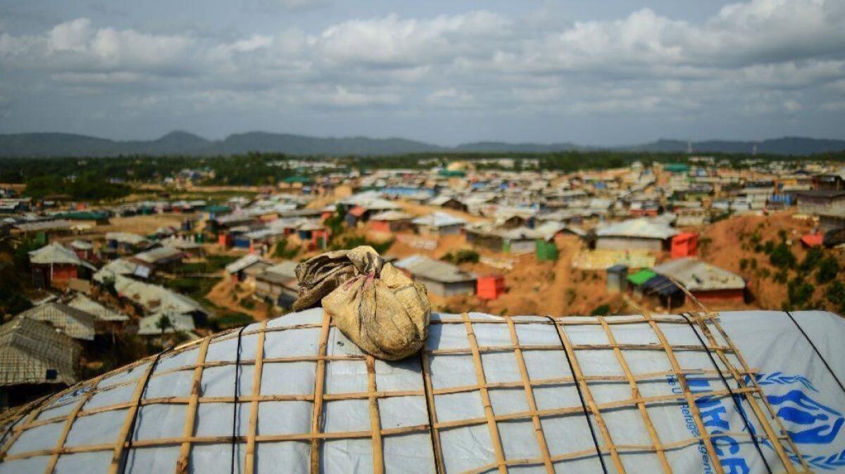 A sand bag weighs down the roof of a shelter in preparation for the upcoming monsoon season in Kutupalong refugee camp in southeastern Bangladesh.