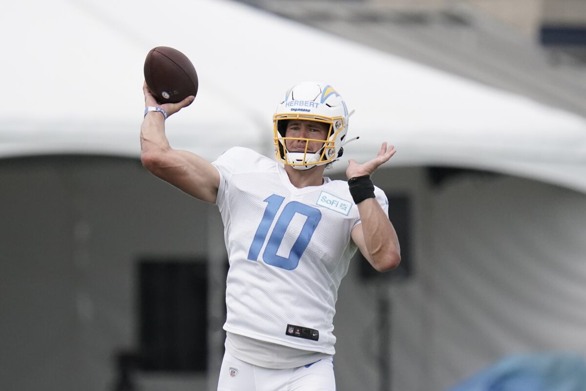 Chargers quarterback Justin Herbert throws the football in practice.