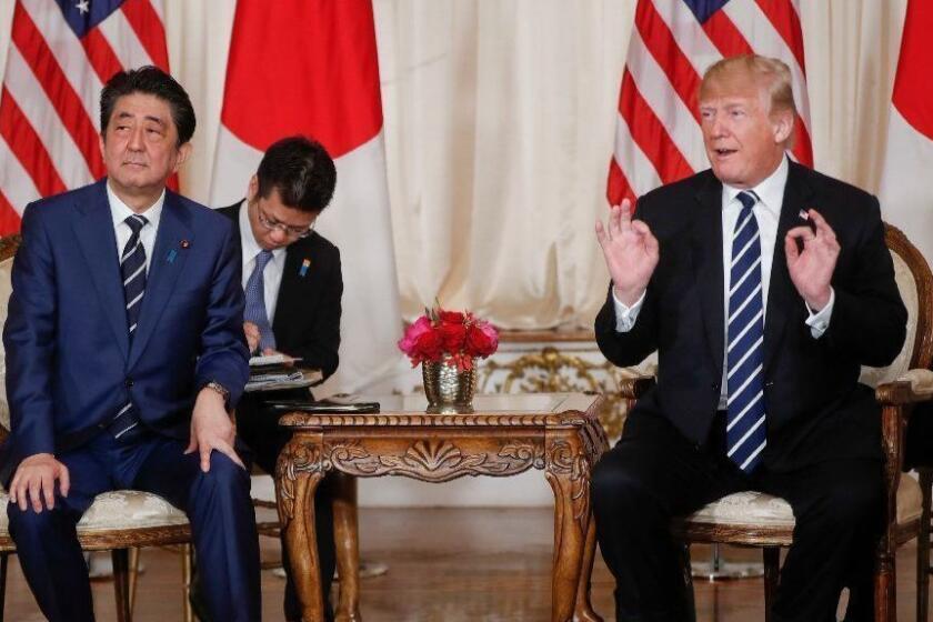 President Donald Trump and Japanese Prime Minister Shinzo Abe, speak during their meeting at Trump's private Mar-a-Lago club, Tuesday, April 17, 2018, in Palm Beach, Fla. (AP Photo/Pablo Martinez Monsivais)