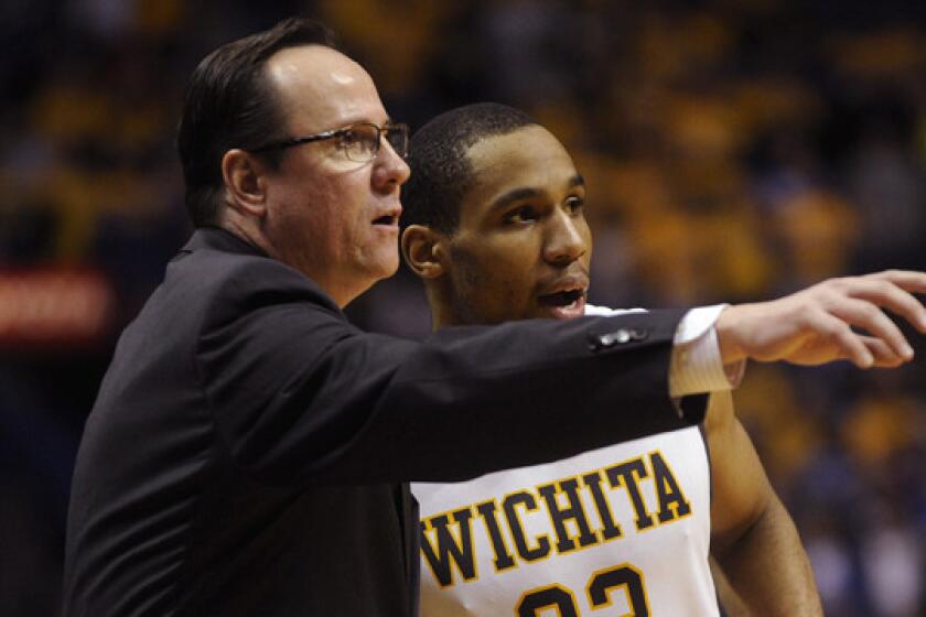 Wichita State Coach Gregg Marshall directs Tekele Cotton during a win over Indiana State on March 9. Marshall has been named coach of the year by the U.S. Basketball Writers Assn.