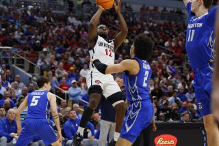 Louisville, KY - March 26: San Diego State's Darrion Trammell scores against Creighton's in an Elite 8 game in the NCAA Tournament on Sunday, March 26, 2023 in Louisville, KY. (K.C. Alfred / The San Diego Union-Tribune)