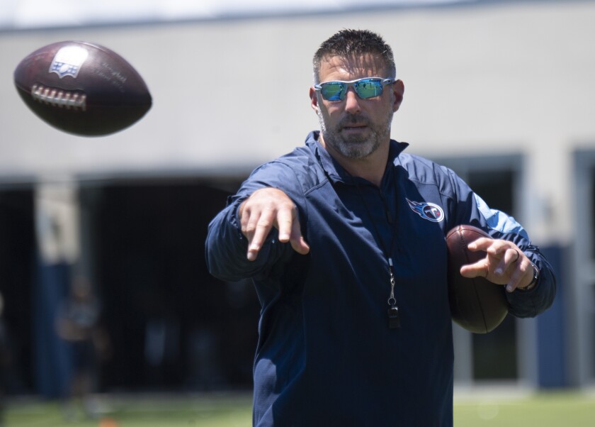 Tennessee Titans coach Mike Vrabel tosses a football during NFL football minicamp Tuesday, June 15, 2021, in Nashville, Tenn. (George Walker IV/The Tennessean via AP, Pool)