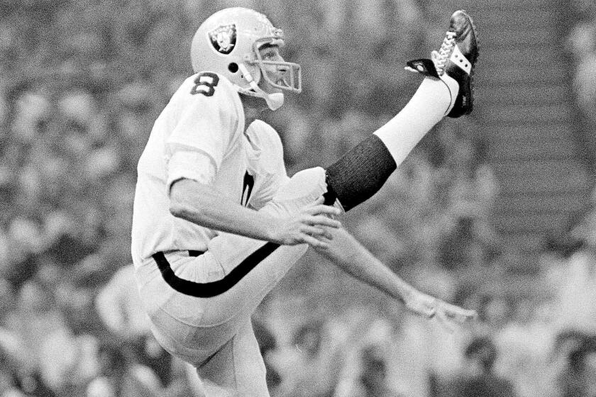 FILE - Oakland Raiders punter Ray Guy kicks during the Super Bowl at the Superdome.