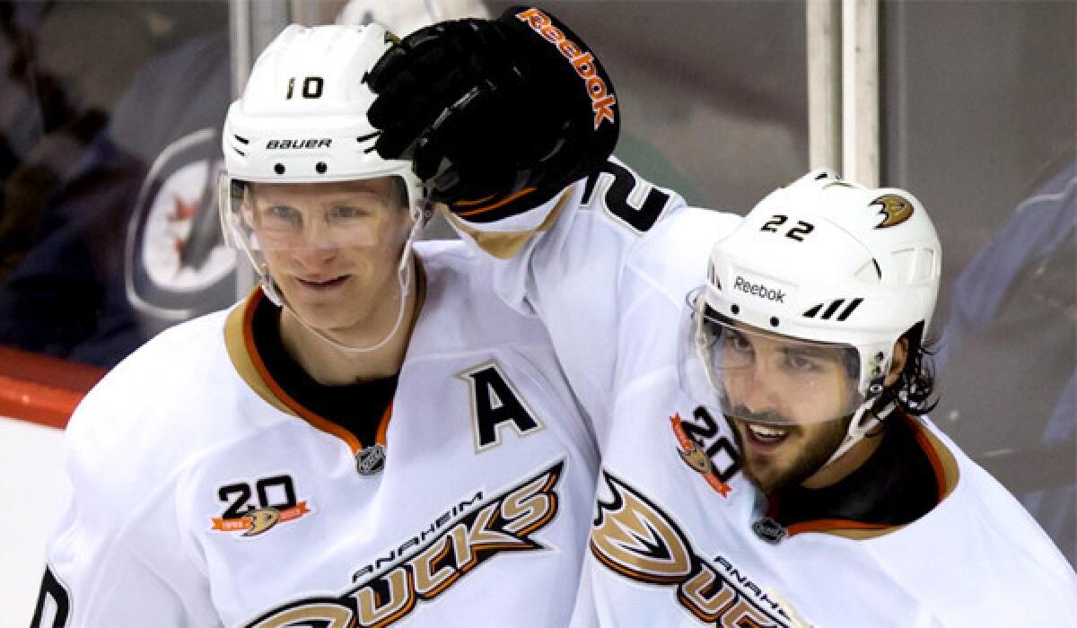 Ducks forwards Corey Perry, left, and Mathieu Perreault celebrate Perreault's goal against the Vancouver Canucks on March 29.