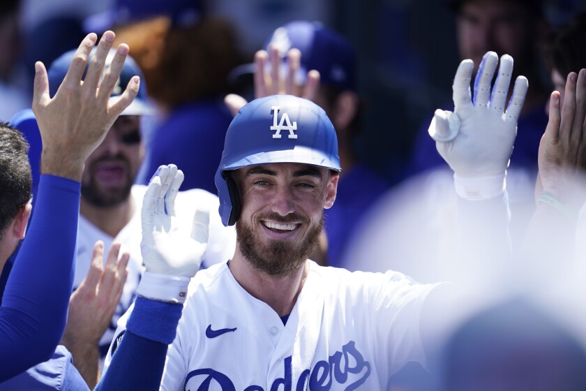 The Dodgers' Cody Bellinger celebrates after hitting a two-run home run against the Marlins on Sunday.