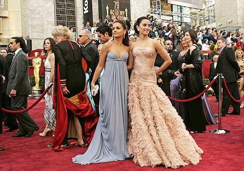 Hollywood put on the glitz for the 79th Annual Academy Awards presentation at the Kodak Theatre in Los Angeles as nominee Penélope Cruz, right, with her sister Monica, take it all in upon arrival.