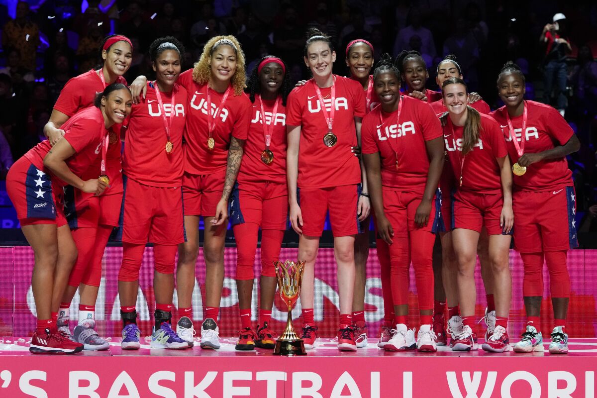 Gold medalists the United States celebrate on the podium after defeating China in the final at the women's Basketball World Cup in Sydney, Australia, Saturday, Oct. 1, 2022. (AP Photo/Mark Baker)