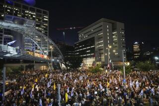 People attend a rally demanding a cease-fire deal and the immediate release of hostages held by Hamas in the Gaza Strip in Tel Aviv, Israel, on Tuesday, Sept. 3, 2024. (AP Photo/Ariel Schalit)