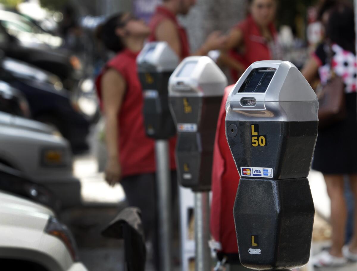 Parking meters line Larchmont Boulevard between Beverly and 1st Street in Los Angeles.