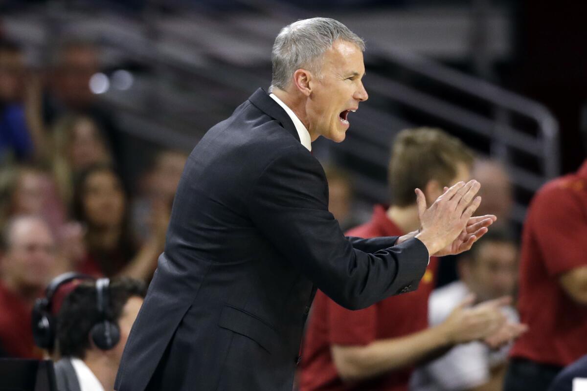 USC coach Andy Enfield yells out instruction during a game.