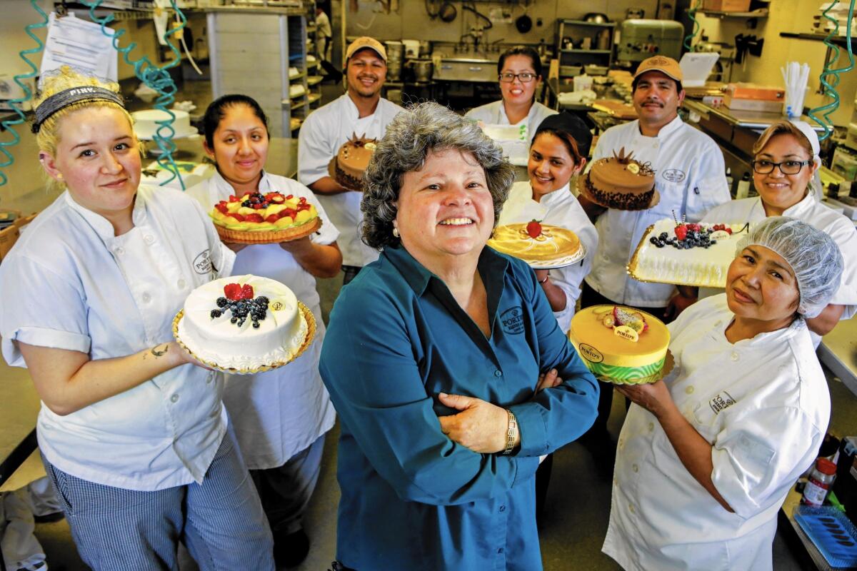 Betty Porto, center, is one of three siblings who run Porto's Bakery & Cafe, the family business founded by their Cuban emigre parents. She's at the chain's Glendale store.