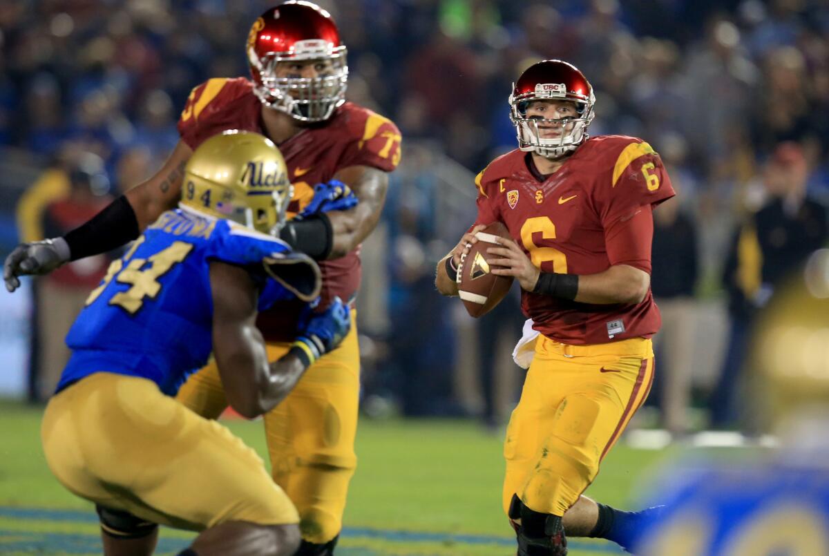 USC quarterback Cody Kessler completed 22 of 34 passes for 214 yards and one touchdown with one interception in a loss to the Bruins, 38-20, on Nov. 22.