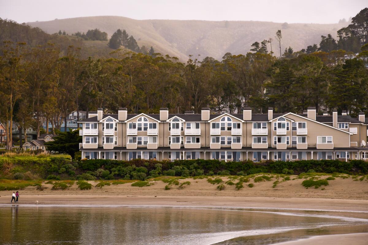 A hotel sits near the beach.