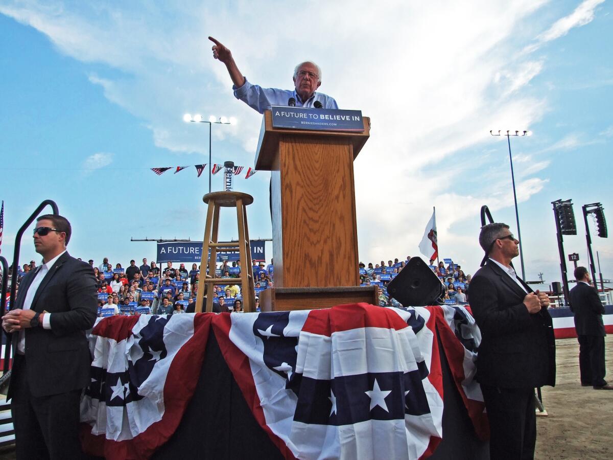 Bernie Sanders speaks to a crowd at the Kern County fairgrounds in Bakersfield.