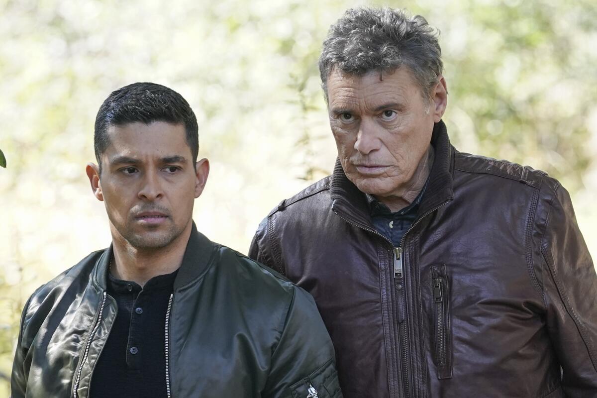 Wilmer Valderrama, left, and Steven Bauer stand next to each other on"NCIS." 