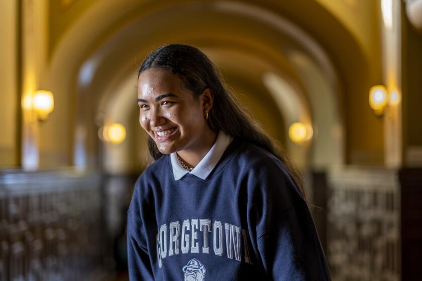 LOS ANGELES, CA - NOVEMBER 18: Portrait of Vaughan Anoa'i, 17, left, at Archer School for Girls on Thursday, Nov. 18, 2021 in Los Angeles, CA. Vaughan Anoa'i, who is a star on the club volleyball circuit and a senior at Archer School for Girls. Her family, which is Black and Samoan, instilled in her a benevolent side that includes her "Block Back" fund-raising program. She's signing a letter of intent with Georgetown on Thursday. (Francine Orr / Los Angeles Times)