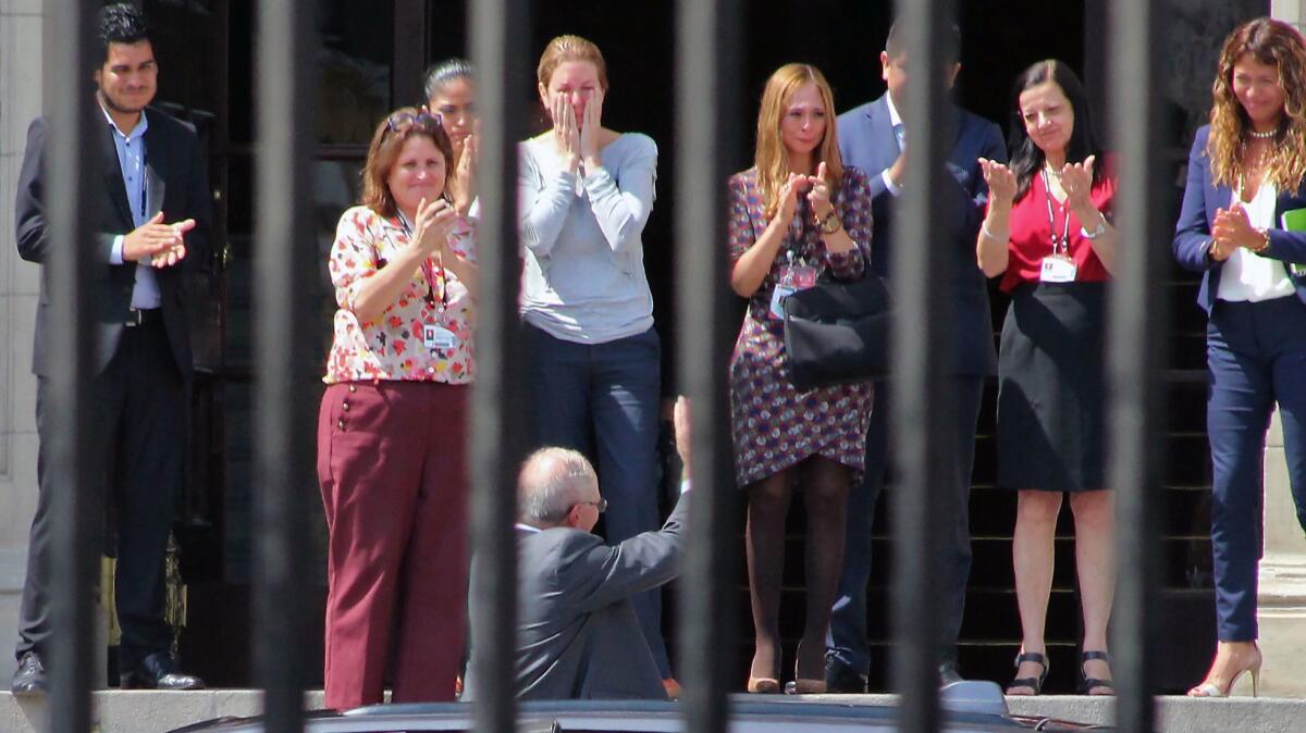 Peruvian former President Pedro Pablo Kuczynski bids farewell to his staff before leaving the Government Palace in Lima, after recording a televised message in which he announced his resignation.