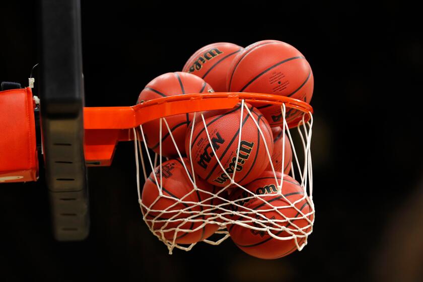 Basketballs fill a net