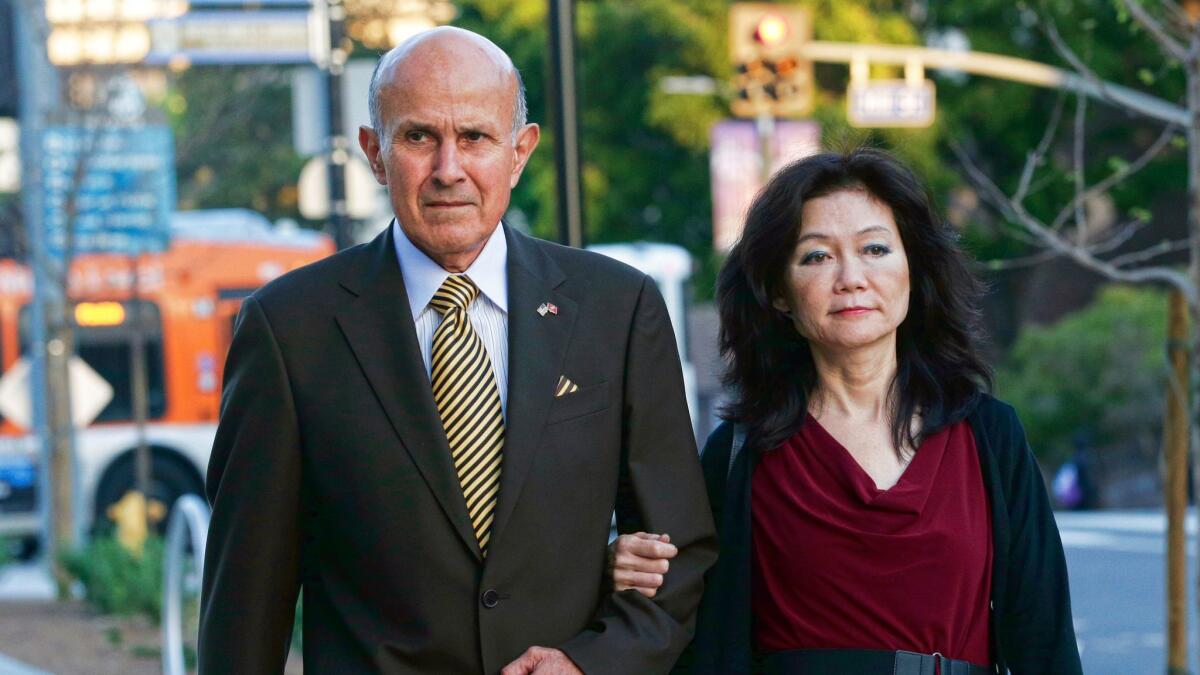 Former Los Angeles County Sheriff Lee Baca arrives with his wife at federal court in Los Angeles on March 15.
