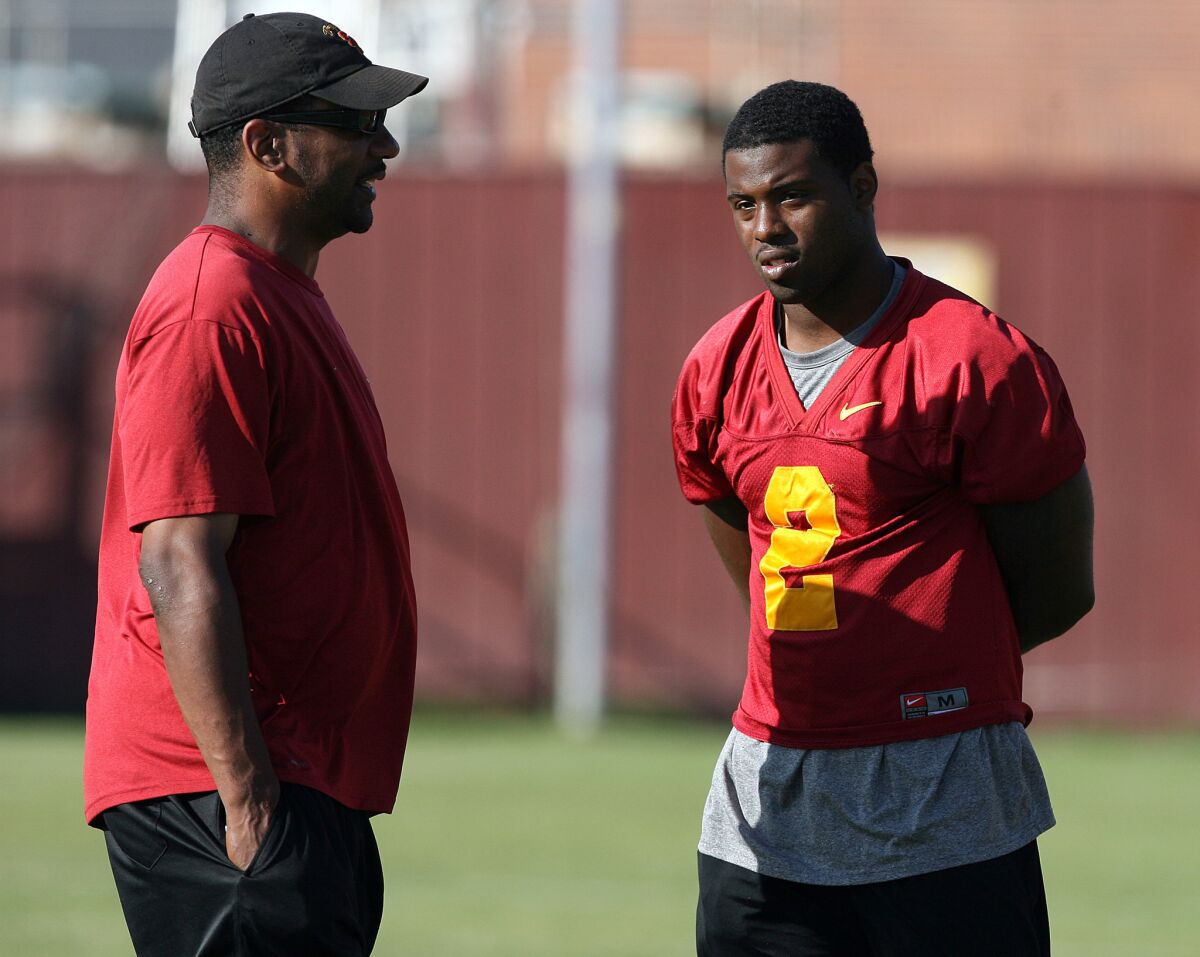 Former USC running backs coach Todd McNair talks with C.J. Gable after a practice on Aug. 20, 2009.