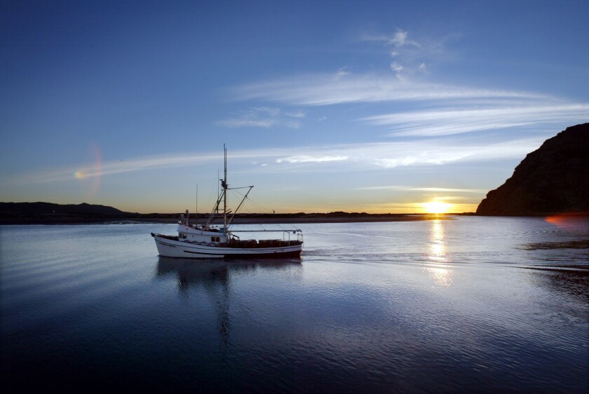 A commercial fishing boat heads out of Morro Bay.