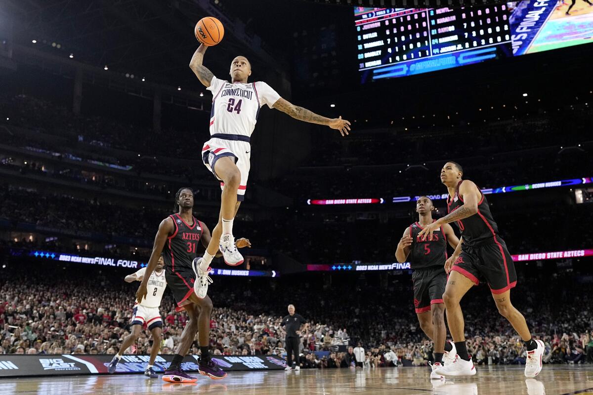 Jordan Hawkins shoots against San Diego State during the men's national championship college basketball game.