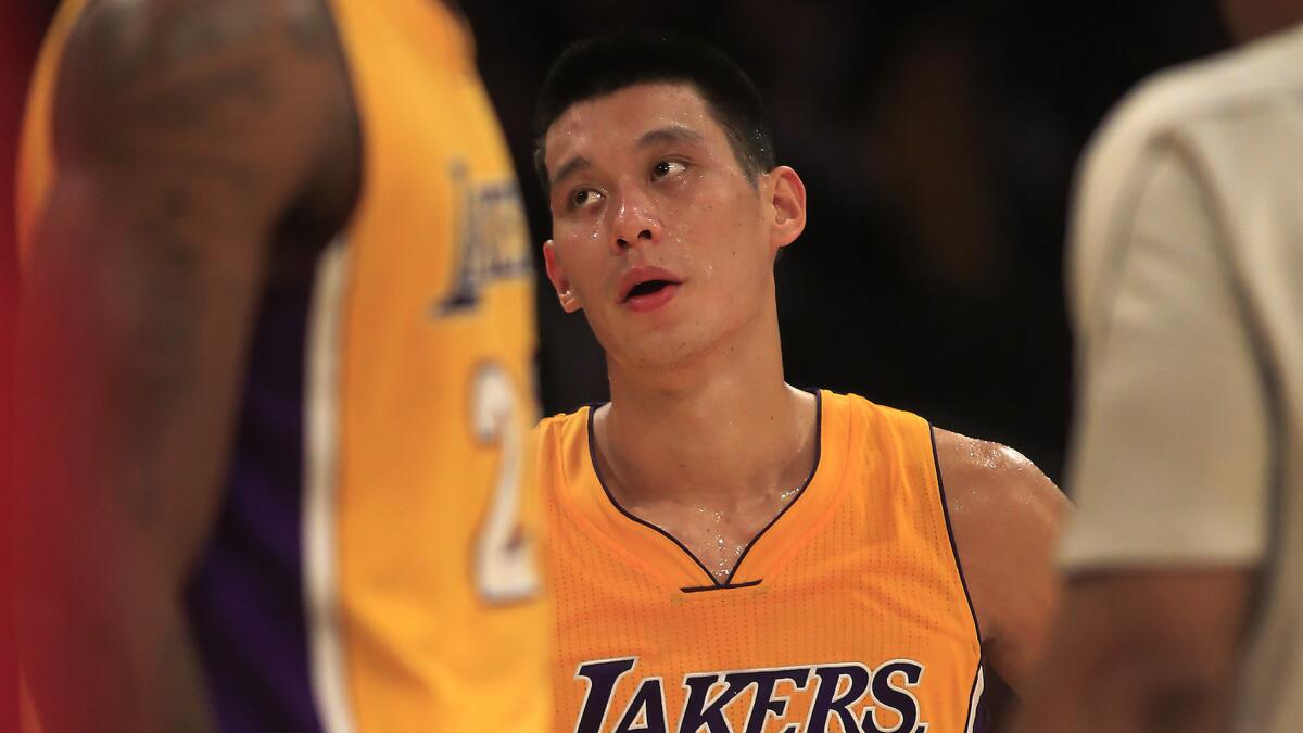 Lakers guard Jeremy Lin looks toward the scoreboard during Friday's loss to the San Antonio Spurs.