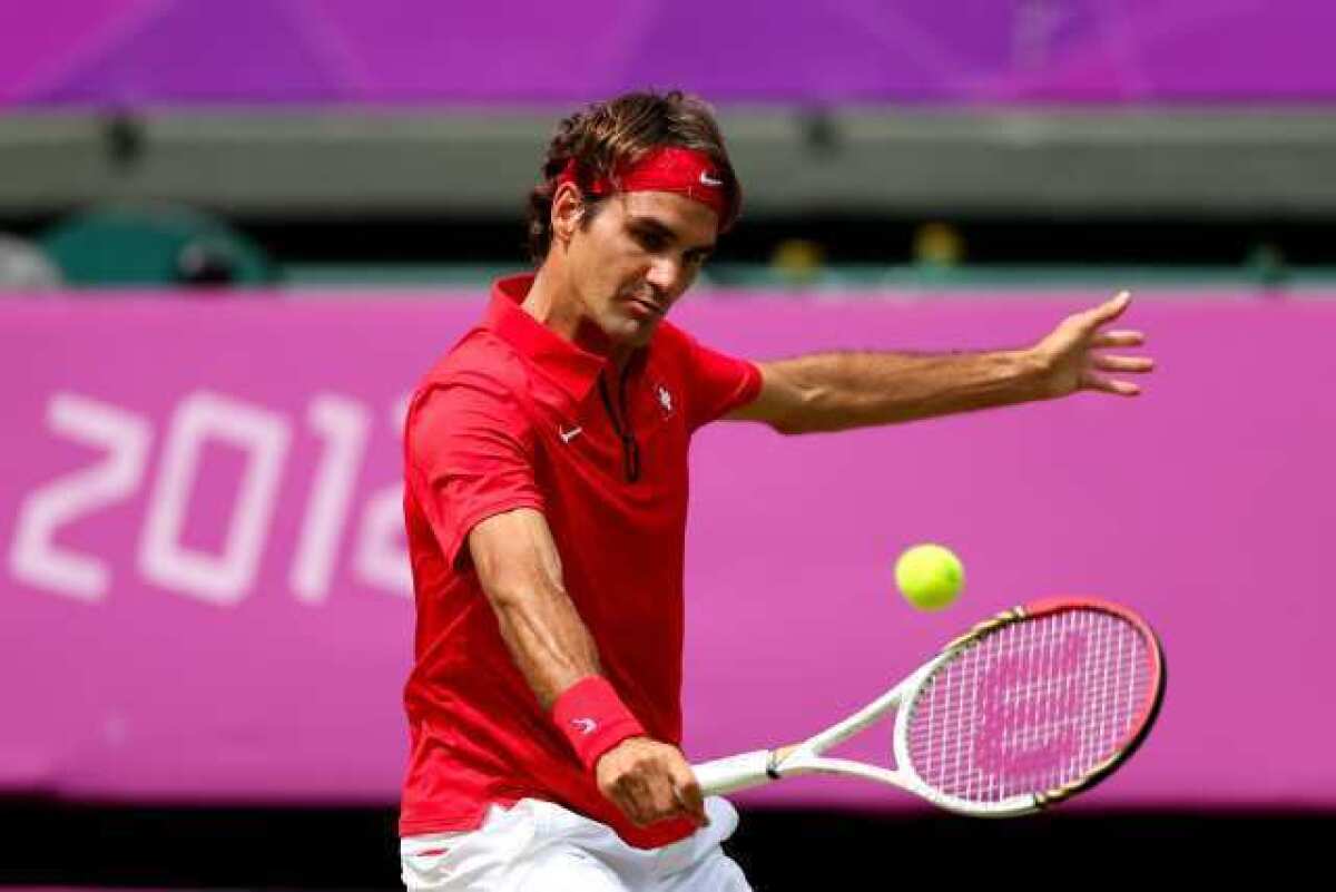 Roger Federer returns a shot against Juan Martin Del Potro.
