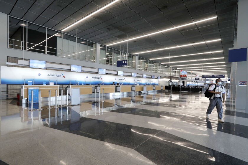 The American Airlines ticket counters at Chicago's O'Hare International Airport are empty on June 16.