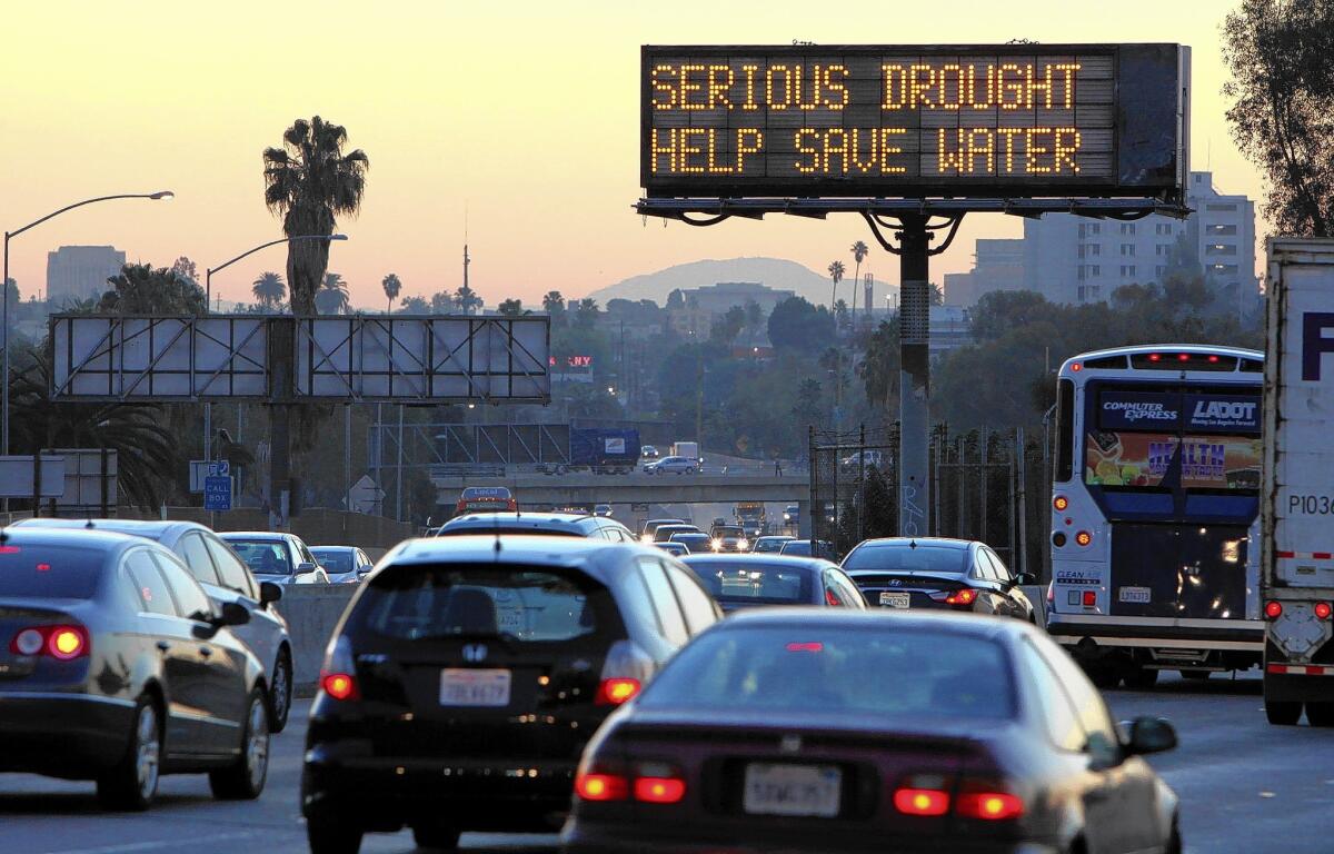 An electronic sign next to the Hollywood Freeway reminds L.A. drivers of California's drought.