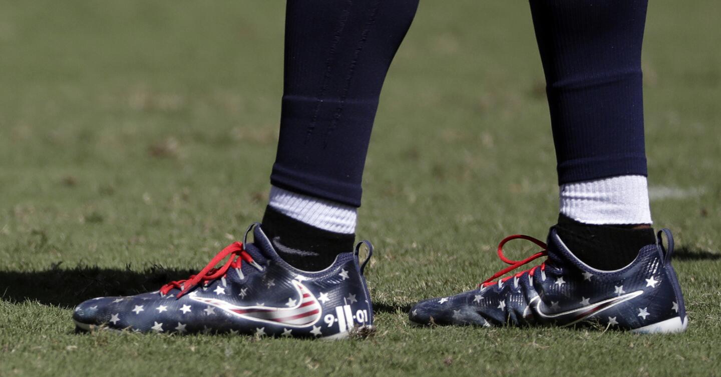 Titans linebacker Avery Williamson wears shoes honoring victims of the 9/11 attacks in the second half of a game against the Vikings on Sept. 11, 2016, in Nashville, Tenn.
