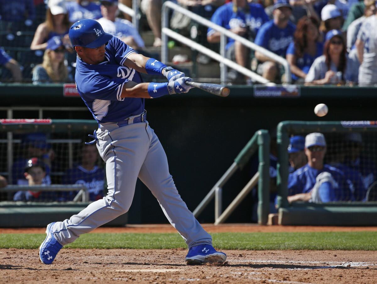 Dodgers infielder Alex Guerrero hits a single Saturday against the Cleveland Indians in Goodyear, Ariz.