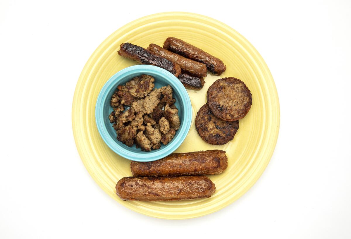 From the bowl, clockwise, Impossible breakfast-style pork sausage, Beyond breakfast links, patties and sausage