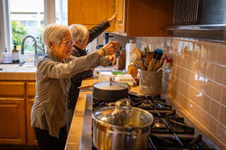 Tony Lam's wife Hop Lam prepares dinner