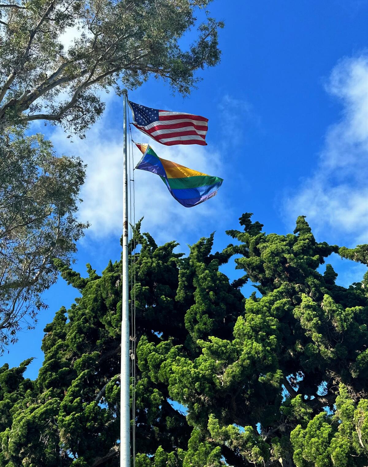 The LGBTQ+ Pride flag flies Wednesday outside Laguna Beach City Hall.