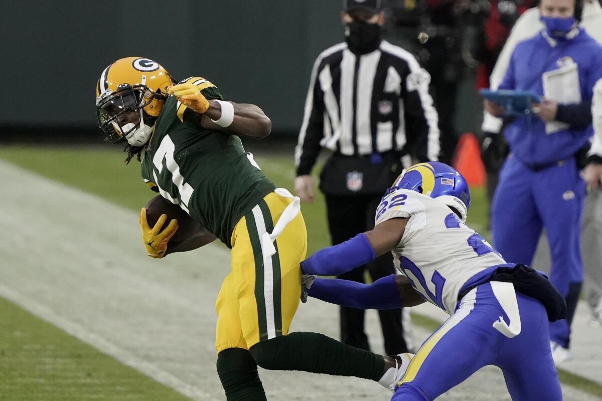 Green Bay Packers wide receiver Davante Adams catches a pass in front of Rams cornerback Troy Hill.