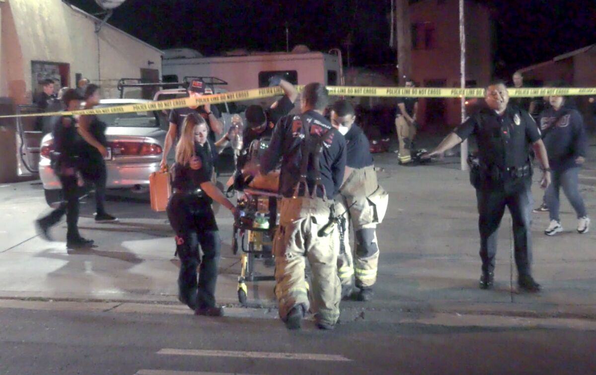 First responders transport a gunshot victim.