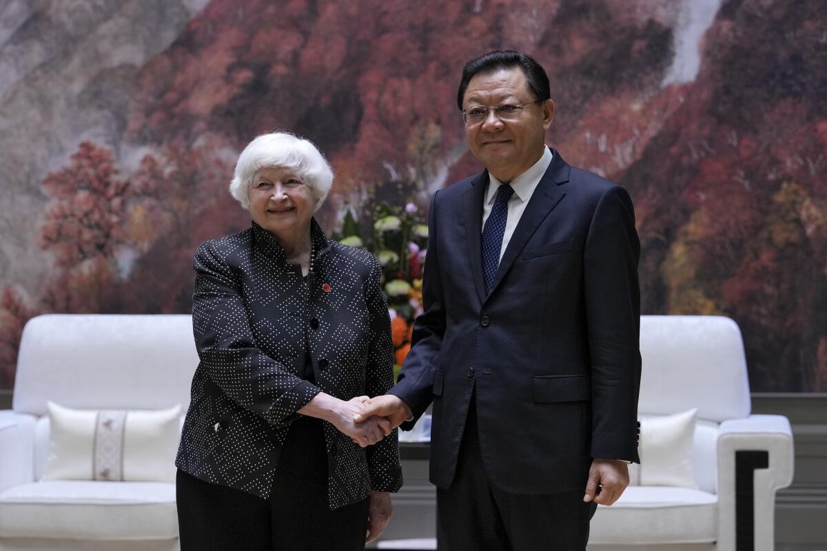 Treasury Secretary Janet Yellen shakes hands with Wang Weizhong, deputy party secretary and governor of Guangdong.