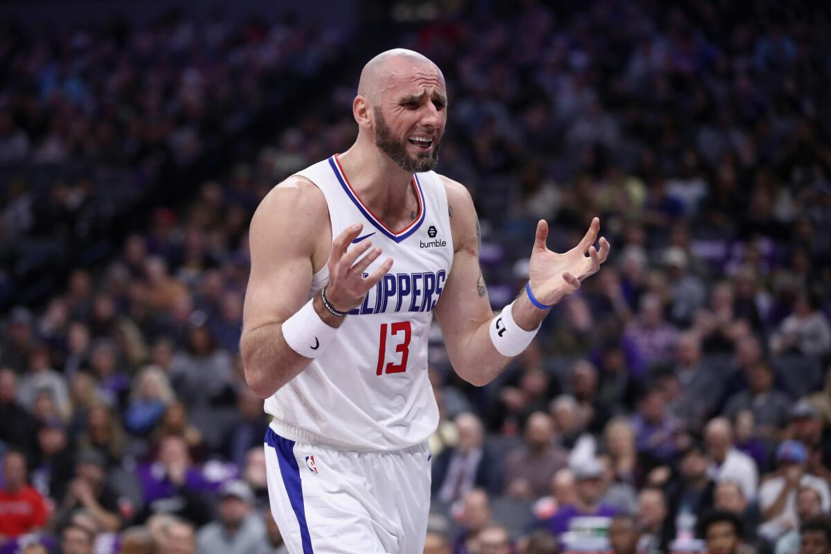 Marcin Gortat #13 of the LA Clippers reacts after he was called for a foul during their game against the Sacramento Kings at Golden 1 Center on November 29, 2018 in Sacramento, California.