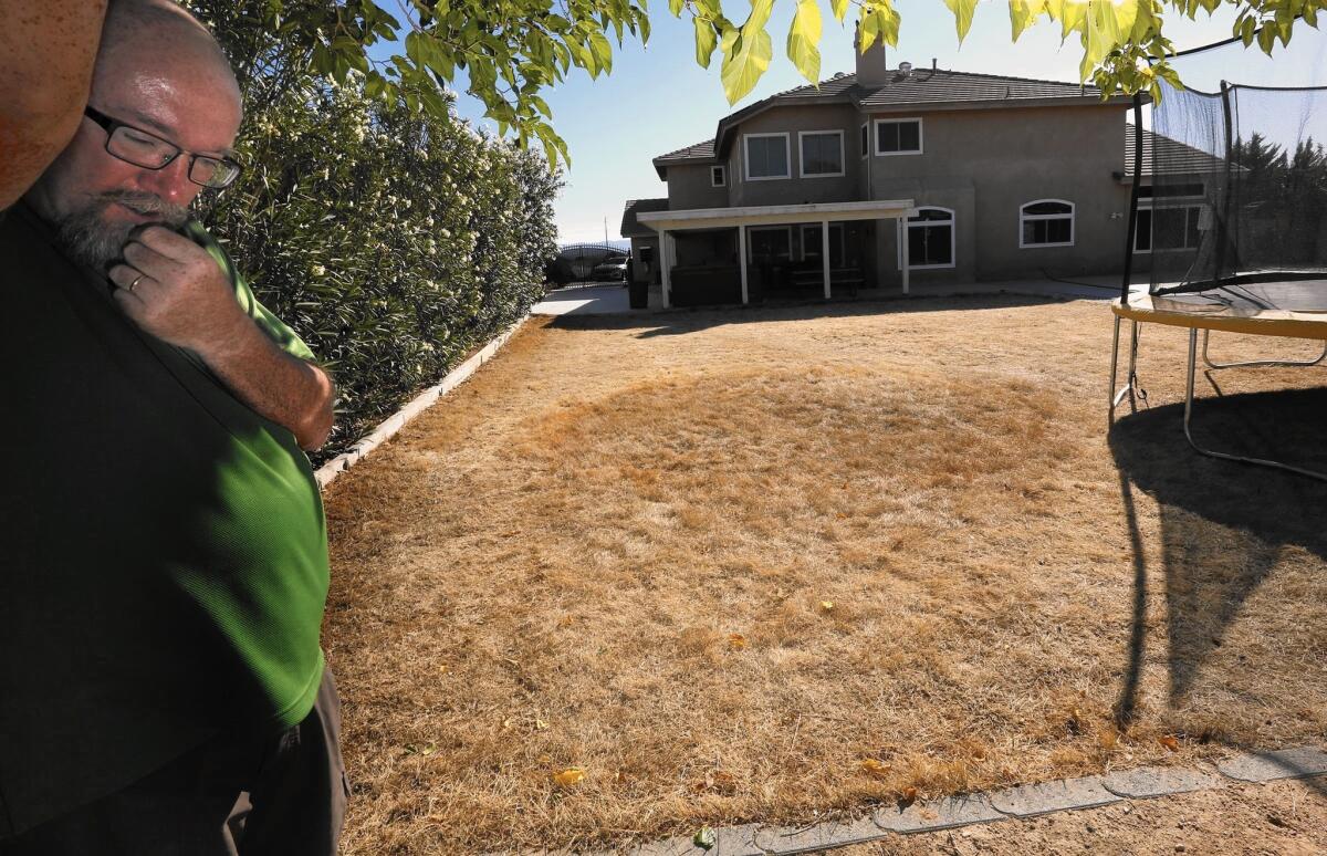 Lance Arnt, an Apple Valley high school teacher, said he was able to get his water bill down to about $85 a month only after severely cutting back his water use. "“Our backyard is a field of hay, basically," he said.