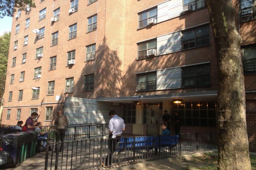 Reporters wait outside the Brooklyn, N.Y., apartment of Idella Carey, Miriam's mother.